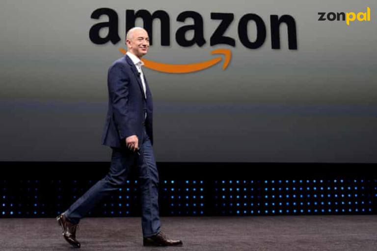 Businessman in suit standing before screen displaying Amazon and Zonpal logos at event